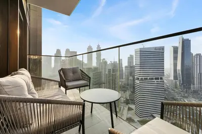 a balcony with a view of a city skyline at 1BR with Direct Burj Khalifa View in Dubai
