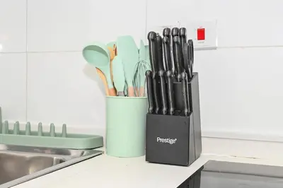 a container filled with utensils on a kitchen counter at Fantastic 2 Bed - Marina in Dubai