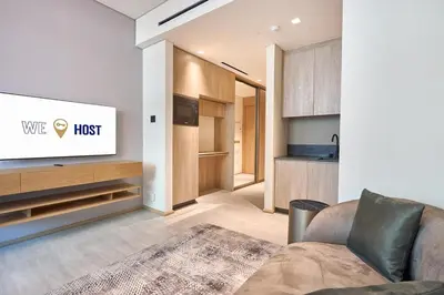 a living room with a couch and a tv at Modern Studio Elegant & Comfort in Dubai