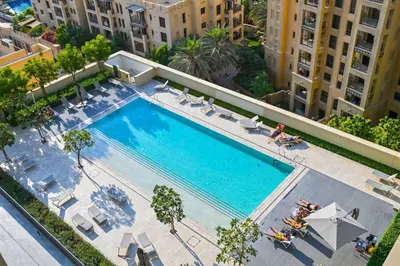 an overhead view of a swimming pool in a building at Full Burj Khalifa View, 3min Walk to Dubai Mall in Dubai