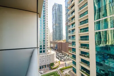 an overhead view of a city with tall buildings at Boho Style 2BHK Apartment With Sea View Next to Tram Station in Dubai
