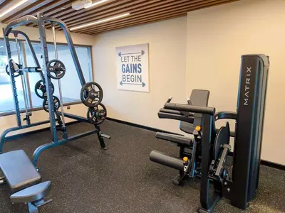 a gym with two treadmills and tread machines at Cozy Spacious Studio in Downtown with Burj Khalifa View in Dubai