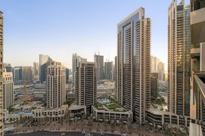 a view of a city with tall buildings at Spacious 1BR in Downtown with Balcony & Pool in Dubai
