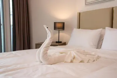 a swan made out of towels on a bed at Business Bay 1BR Burj Khalifa&Canal Views,3Balcony in Dubai