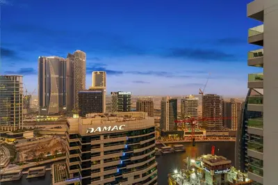 a view of a city skyline with tall buildings at FIRST CLASS 1BR Canal View Escape in Dubai