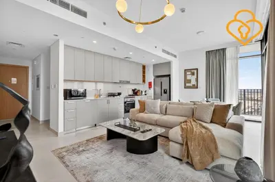 a living room with a couch and a kitchen at Keysplease Beautiful 2 BR Creek Crescent Water View, Harbour in Dubai