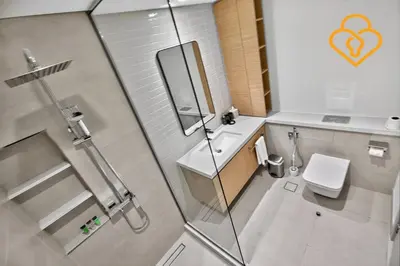 a bathroom with a shower and a toilet and a sink at Keysplease Beautiful 2 BR Creek Crescent Water View, Harbour in Dubai