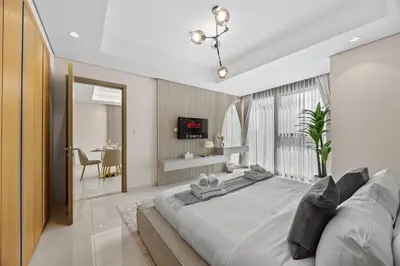 a bedroom with a large bed in a room at Paramount Midtown, Luxury 1BR with Infinity Pool with Burj View in Dubai