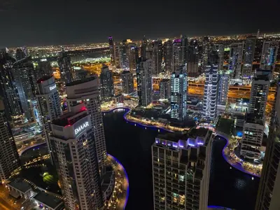 a view of a city at night at Penthouse four bedroom with two large chillout terraces in Dubai