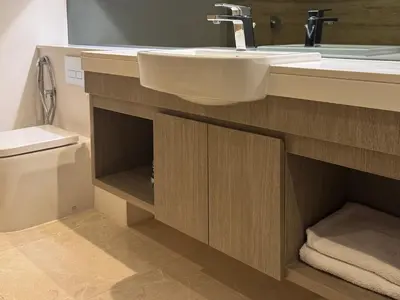 a bathroom with a sink and a toilet at The Sterling 4 sleep with AC parking and pool in Dubai