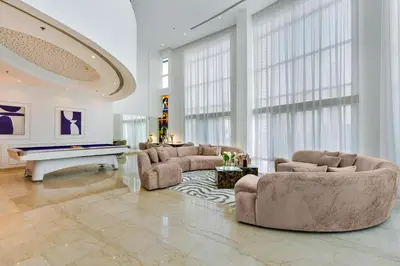 a living room with couches and a pool table at Private villa in Marina with private pool!!! in Dubai