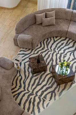 a living room with a couch and a zebra carpet at Private villa in Marina with private pool!!! in Dubai