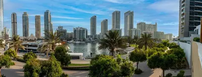 a city with a body of water and tall buildings at Private villa in Marina with private pool!!! in Dubai