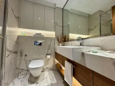 a bathroom with a toilet and a sink at Stylish Studio In Azizi Riviera 59 in Dubai