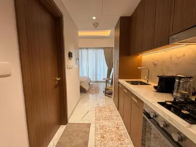 a kitchen with a sink and a counter top at Stylish Studio In Azizi Riviera 59 in Dubai