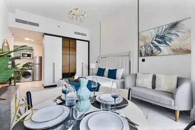 a living room with a table and a couch at Bookable Stylish Dubai escape with private pool in Dubai