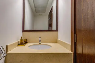 a bathroom with a sink and a mirror at Residences 1 Tower 5 E2 - 2BR Apartment - Allsopp & Allsopp in Dubai