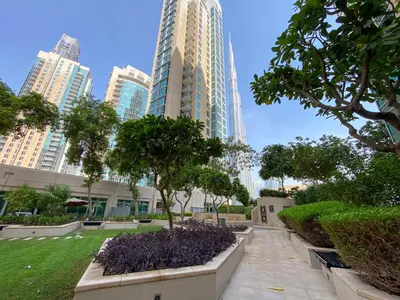 a park in the middle of a city with tall buildings at Residences 1 Tower 5 E2 - 2BR Apartment - Allsopp & Allsopp in Dubai
