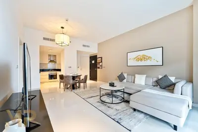 a living room with a couch and a table at Marcopolo - Experience modern living in Business Bay Dubai in Dubai