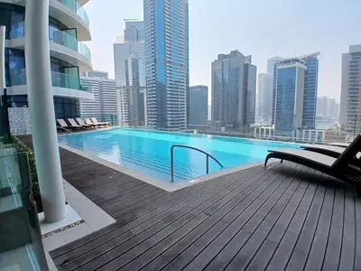 a swimming pool on the roof of a building at TRPS - Imperial Avenue, Downtown - Burj Khalifa View, Brand New, Amazing Facilities in Dubai
