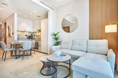 a living room with a couch and a table at STAY BY LATINEM Luxury 1BR Holiday Home W 2809 Near Burj Khalifa in Dubai