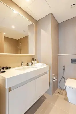 a bathroom with a sink and a toilet at Full Burj Khalifa View, 3min Walk to Dubai Mall, 29th floor in Dubai