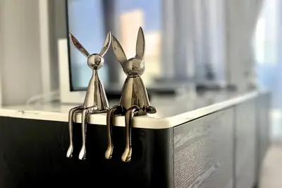 a pair of forks sitting on top of a counter at Luxury 1 Bed Apt in Palace, Dubai Creek Harbour in Dubai