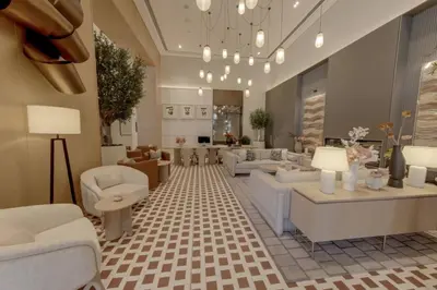 a living room with white couches and tables at New 2BR Luxe Vida Dubai Mall Direct Access in Dubai
