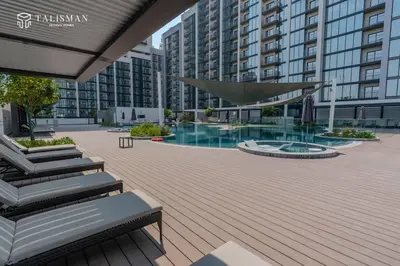 a courtyard with a swimming pool in a building at Luxury 1BR Burj Khalifa & Flamingo Sanctuary Views in Dubai