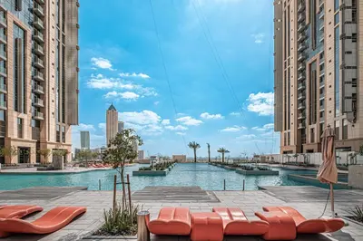 a pool in the middle of a city with buildings at Luxury Leisure Massive Pool Oasis in Amna Tower in Dubai