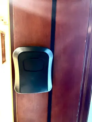 a blue chair sitting on the side of a door at Spacious Modern High Floor Independent Studio Downtown in Dubai