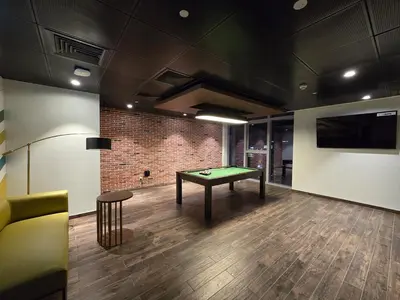 a room with a pool table and a couch at Luxury 2BHK in DownTown with Burj Khalifa View Imperial 2415 in Dubai