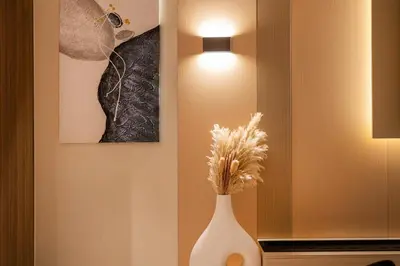 a white vase sitting on a table with a light at Luxury 2BHK in DownTown with Burj Khalifa View Imperial 2415 in Dubai