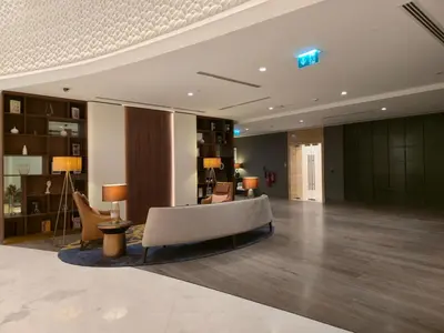 a lobby with a couch and chairs in a building at Luxury 2BHK in DownTown with Burj Khalifa View Imperial 2415 in Dubai