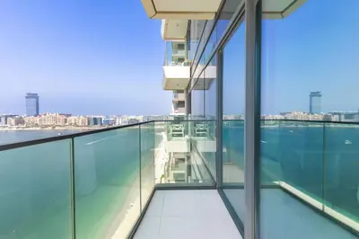an empty balcony of a building with a view of the water at Dubai Dream Stay - 2-BR with Sea View in Beach Vista in Dubai