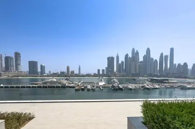 a view of a city with boats in a harbor at Prime 1 Bedroom with Private Beach in Beachfront in Dubai