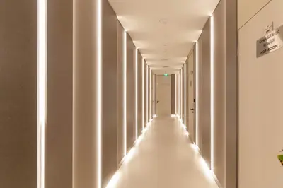 a corridor with white columns in a building at Silkhaus Luxury 1BR at Marina Star in Dubai Marina in Dubai