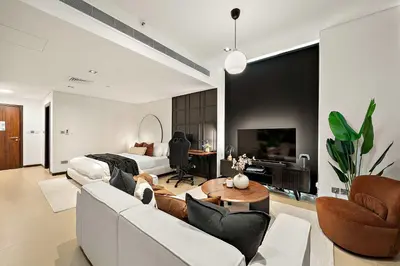 a living room with a couch and a bed at Silkhaus Gamer's Dream Studio in Liberty House in Dubai