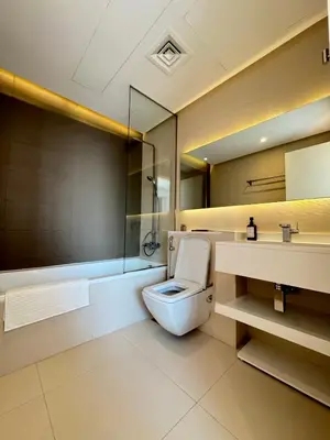 a bathroom with a toilet and a sink at One bedroom Apartment in Dubai Marina next to the Marina Mall in Dubai
