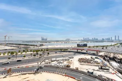 an aerial view of a highway with a city in the background at GuestReady - Furnished Studio | Burj & Canal Views in Dubai