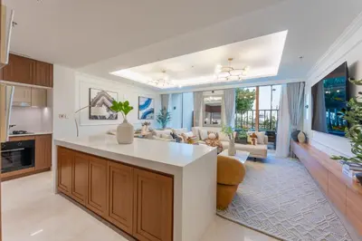a kitchen with a large island in a living room at Palace Residence Beach Villa - Direct Beach Access in Dubai