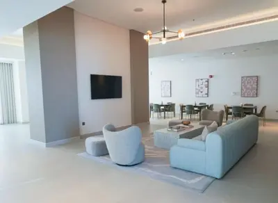 a living room with a couch and chairs and a table at Locations l Chic 3 Bedroom l Burj and Fountain Views l Downtown Dubai in Dubai