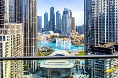 a view of a city with tall buildings at Vogue Downtown Forte near Dubai Mall and Burj Khalifa, Three-Bedroom Plus Kids room with Balcony and Fountain view, full access to all amenities in Dubai