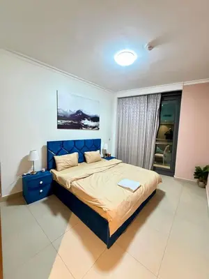 a bedroom with a blue bed in a room at Private room in 3BR Ultra-Luxury-High-Rise Apartment next to BURJ KHALIFA, DUBAI MALL in Dubai