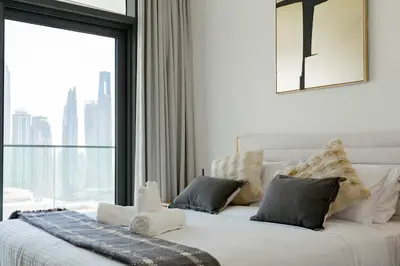 a bedroom with a large bed with a large window at TRPS - Beach Vista, Dubai Harbour - Ain Dubai View, Furnished, Private Beach Access in Dubai