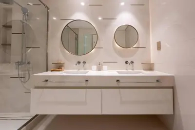a white bathroom with two sinks and a shower at TRPS - Beach Vista, Dubai Harbour - Ain Dubai View, Furnished, Private Beach Access in Dubai