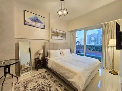 a bedroom with a large bed and a large window at 2BhK Big Balcony&Canal View Waterfront dubai mall in Dubai