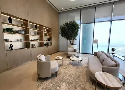 a living room with a couch and chairs and a table at Crest Serene Stay for 4 Guests 1BR and Cozy Room in Dubai