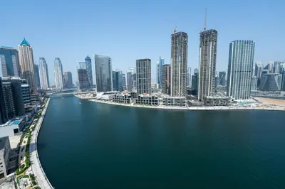 a view of a city with a river and buildings at Burjkhalifa View Top Floor Dubai Mall 7Mins in Dubai