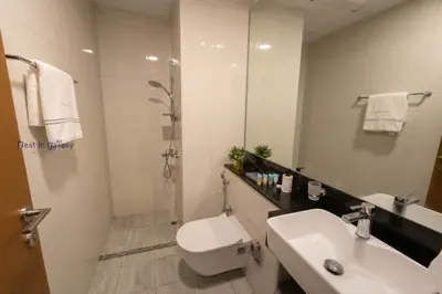 a bathroom with a toilet and a sink and a shower at Burjkhalifa View Top Floor Dubai Mall 7Mins in Dubai